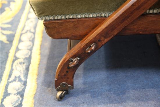 A Victorian Reformed Gothic walnut and marquetry Reclining Chair, designed by Charles Bevan, c.1865, under licence to Marsh, Jones &